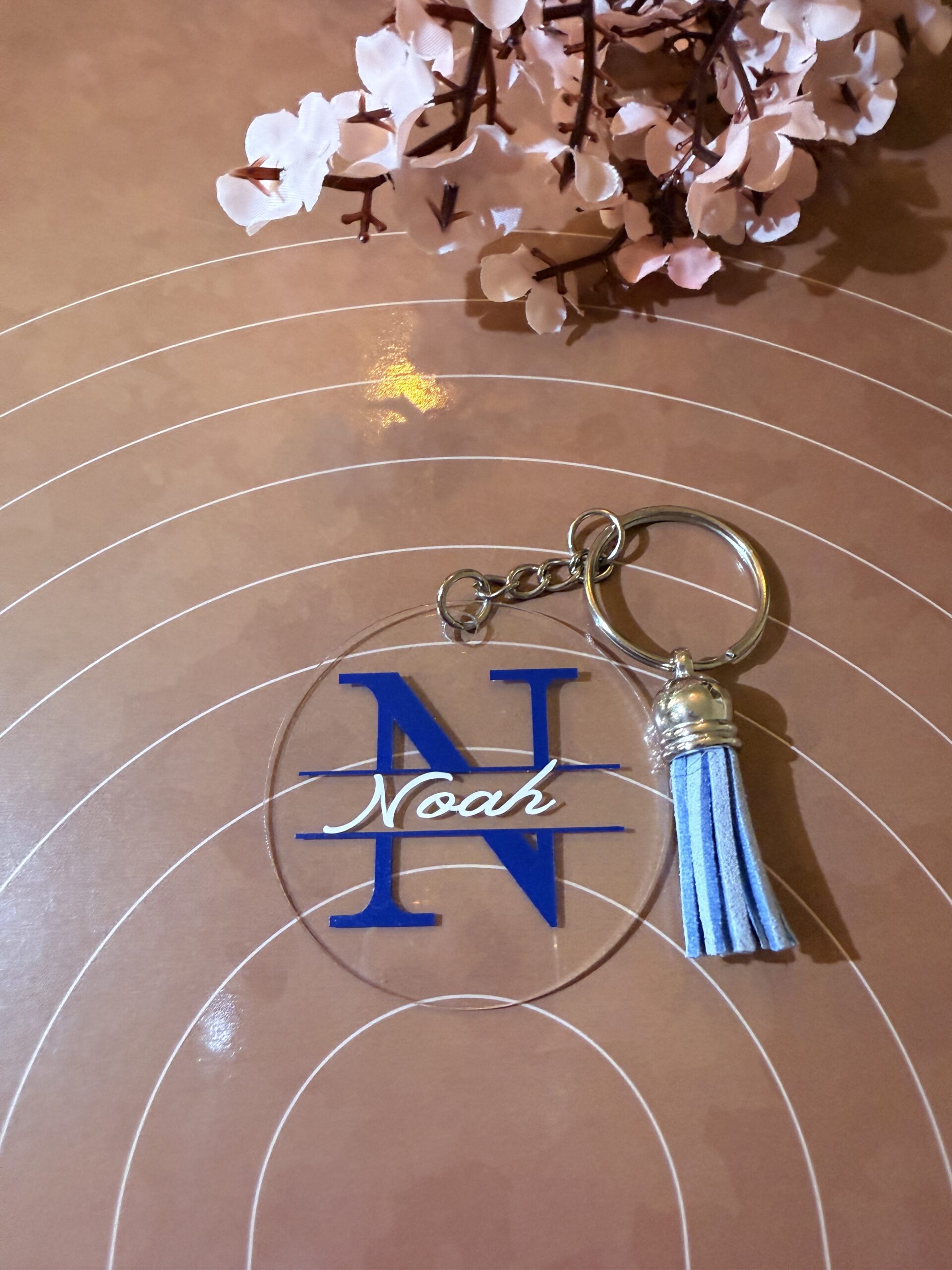 A woman wearing a bracelet with a evil eye on it